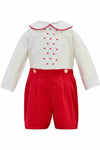 Carriage Boutique red and white cotton bobby suit with a Peter Pan collar, red polka dots, and button-front shorts.
