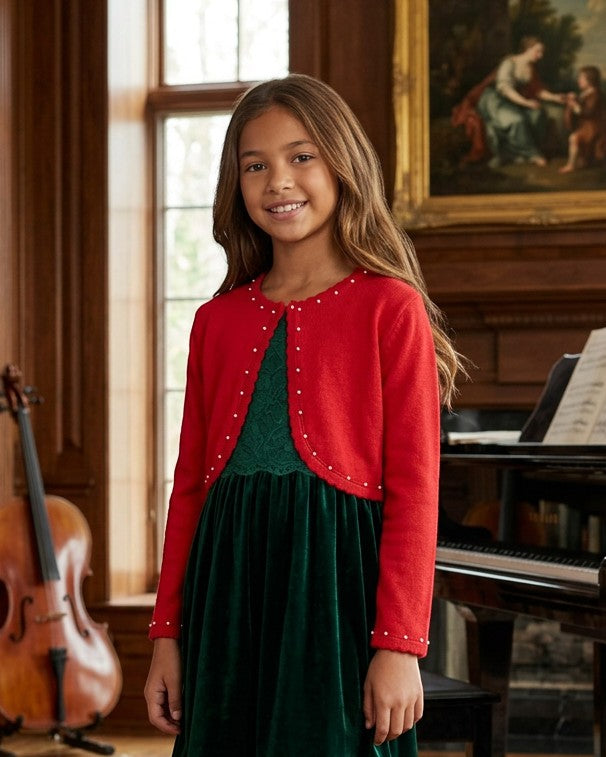 Carriage Boutique red bolero sweater with pearl accents worn by a young girl over a green velvet dress