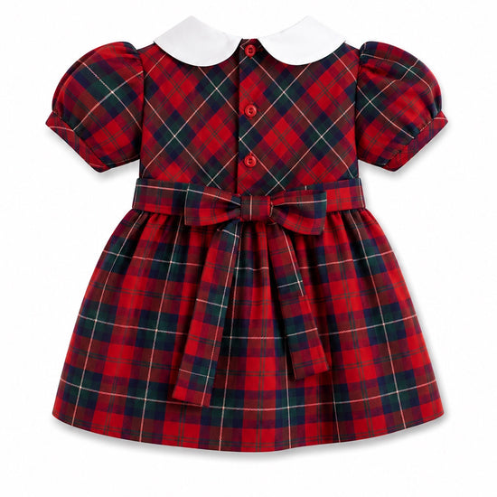 Carriage Boutique red and green plaid baby girl dress with a white Peter Pan collar, puff sleeves, and back bow tie.
