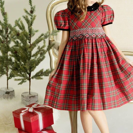 Carriage Boutique toddler girl wearing a red plaid cotton party dress with short sleeves and intricate yoke detail.