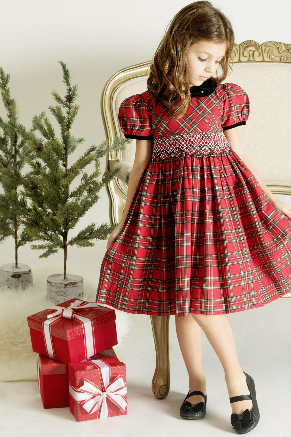 Carriage Boutique toddler girl wearing a red plaid cotton party dress with short sleeves and intricate yoke detail.