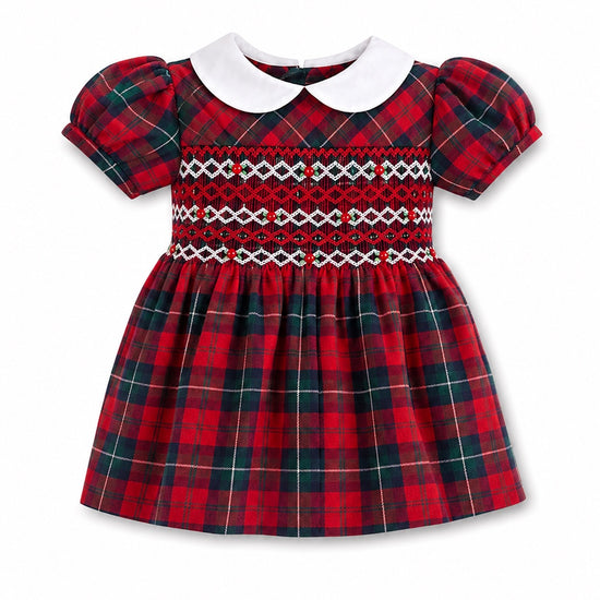 Carriage Boutique baby girl dress in red and green plaid with hand-smocked bodice, puff sleeves, and white collar.