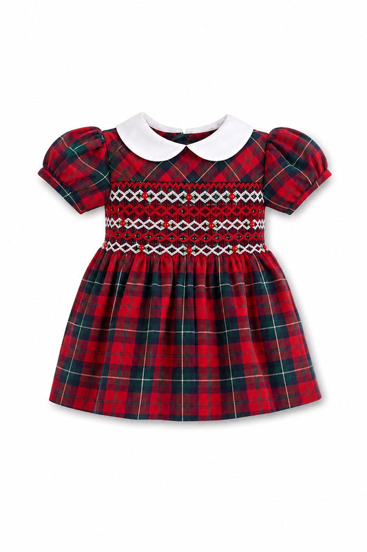 Carriage Boutique baby girl dress in red and green plaid with hand-smocked bodice, puff sleeves, and white collar.
