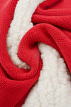 Close-up of Carriage Boutique red knit cotton fabric with soft off-white sherpa lining texture