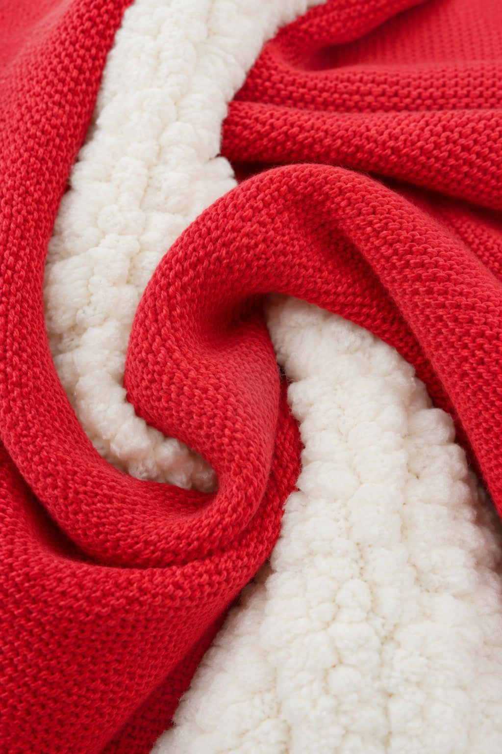 Close-up of Carriage Boutique red knit cotton fabric with soft off-white sherpa lining texture