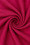 Carriage Boutique red poly silk fabric with a subtle textured weave in a swirling pattern