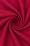 Carriage Boutique red poly silk fabric with a subtle textured weave shown in a close-up swirl pattern.