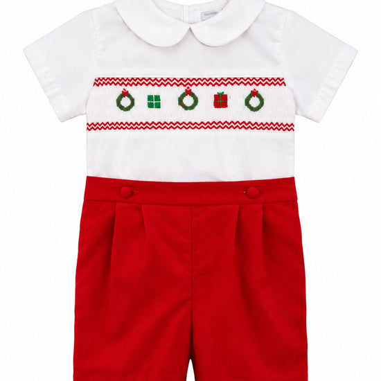 Carriage Boutique red and white cotton bobby suit featuring hand-smocked Christmas motifs and a Peter Pan collar.
