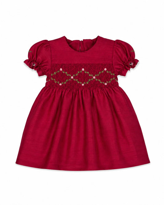 Carriage Boutique red baby girl dress with smocked floral embroidery, puffy sleeves, and a round neck in poly silk.