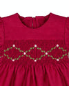 Carriage Boutique red silk baby dress with smocked floral embroidery, round neck, and puffy short sleeves.