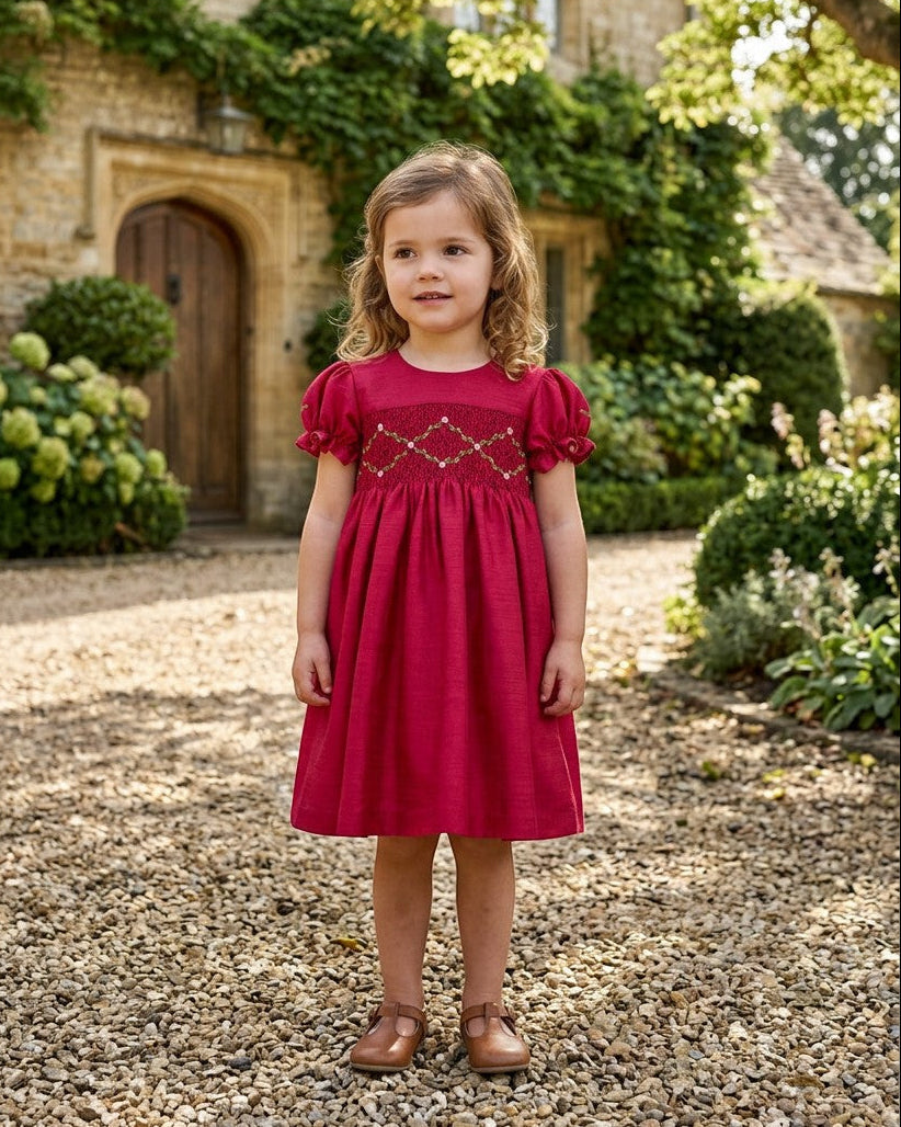 Carriage Boutique toddler girl red silk dress with smocked floral chest detail and puffy short sleeves