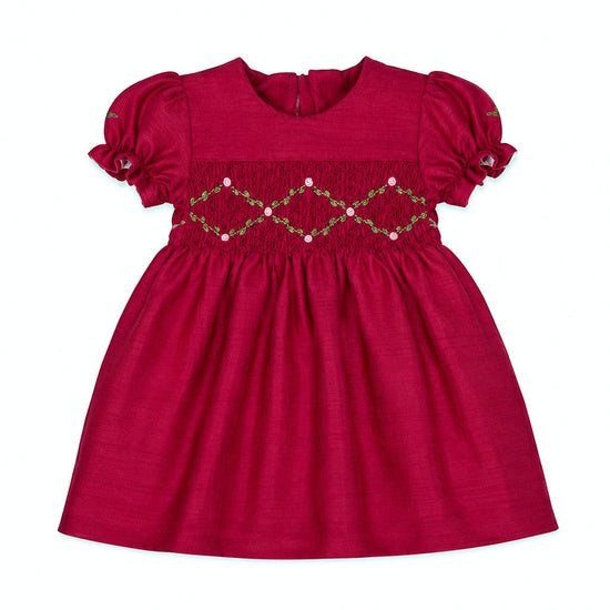 Carriage Boutique red silk baby girl dress with smocked floral embroidery, puffy sleeves, and a round neck.