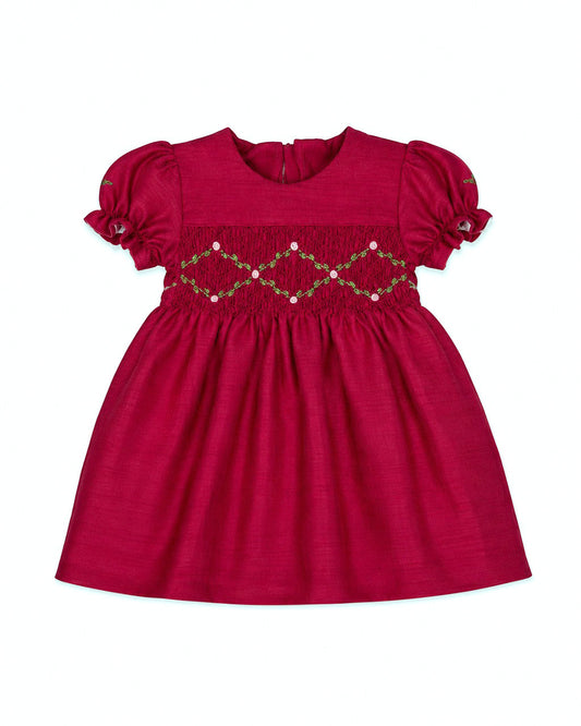 Carriage Boutique red silk baby girl dress with smocked floral embroidery, puffy sleeves, and a round neck.