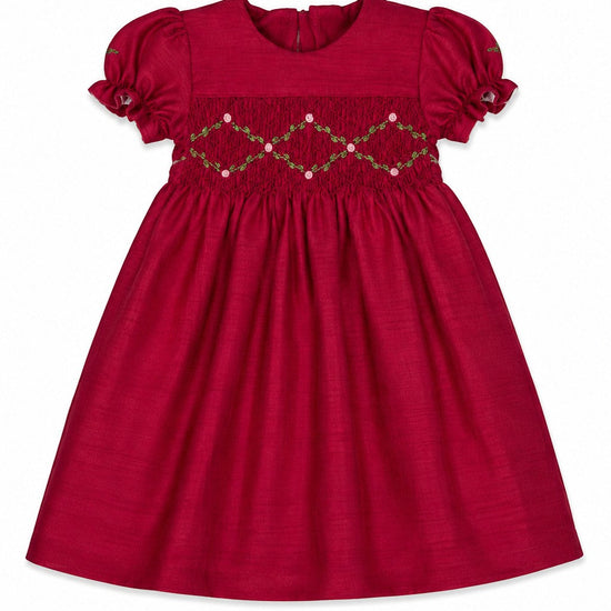 Carriage Boutique red toddler girl dress with smocked floral embroidery, puffy sleeves, and a round neck.