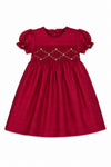Carriage Boutique red toddler girl dress with smocked floral embroidery, puffy sleeves, and a round neck.