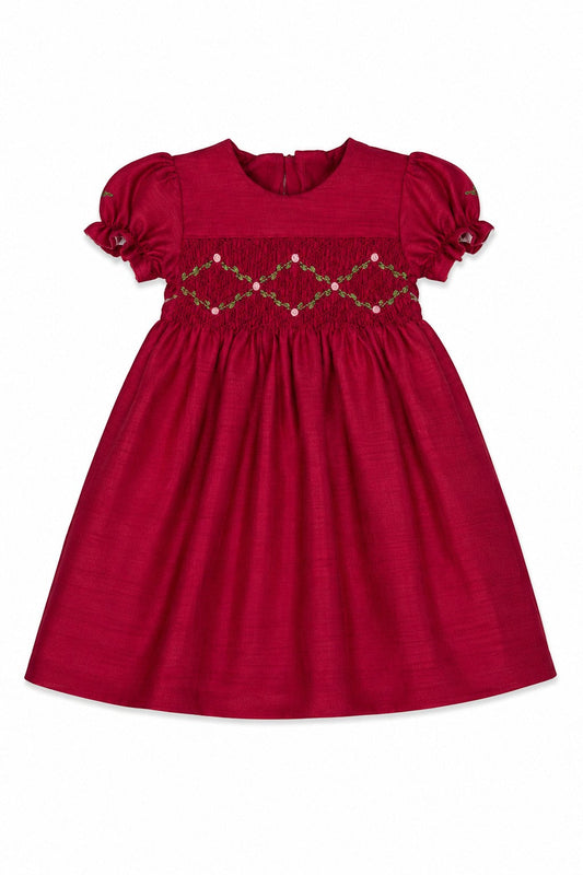 Carriage Boutique red toddler girl dress with smocked floral embroidery, puffy sleeves, and a round neck.