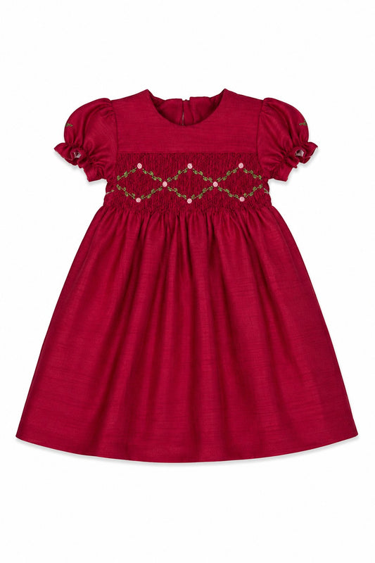 Carriage Boutique red toddler girl dress with smocked floral embroidery, puffy sleeves, and a round neck.