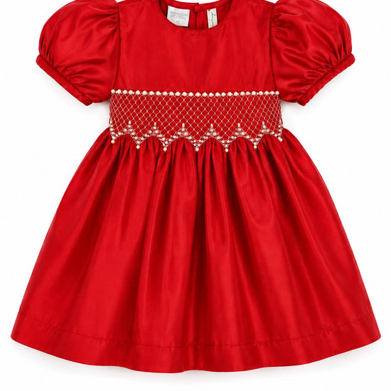 Carriage Boutique red taffeta baby dress with puffed sleeves, smocked diamond detailing, and white bead accents.