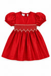 Carriage Boutique red taffeta baby dress with puffed sleeves, smocked diamond detailing, and white bead accents.