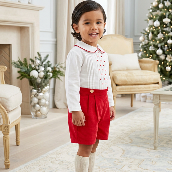 Carriage Boutique red and white cotton bobby suit for toddlers featuring a pleated shirt and red shorts