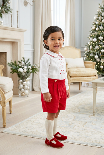 Carriage Boutique red and white cotton bobby suit for toddlers featuring a pleated shirt and red shorts