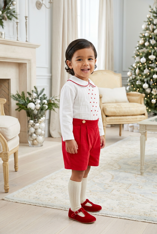 Carriage Boutique red and white cotton bobby suit for toddlers featuring a pleated shirt and red shorts