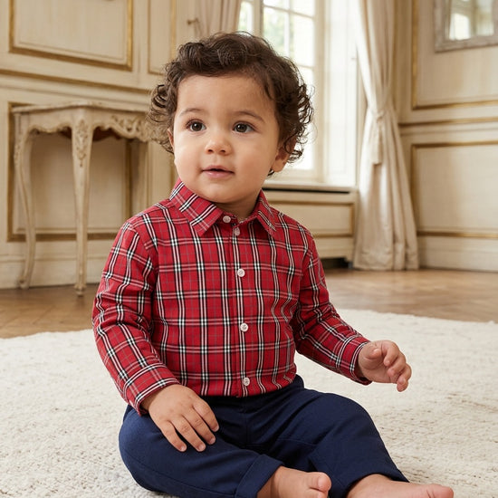 Carriage Boutique baby boy wearing a red and white plaid long sleeve cotton shirt with a classic collar