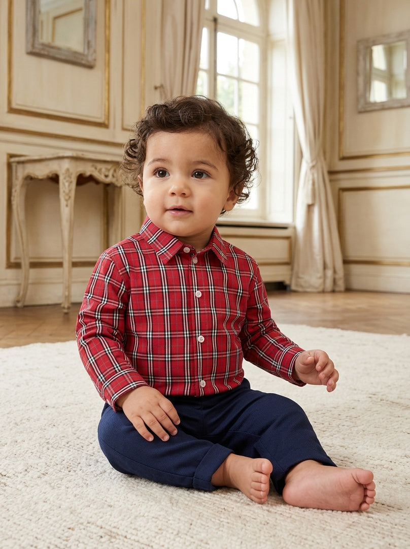 Carriage Boutique baby boy wearing a red and white plaid long sleeve cotton shirt with a classic collar