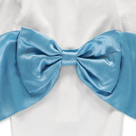 Carriage Boutique white ribbed newborn sleep sack featuring a large, elegant shimmering blue satin decorative bow.