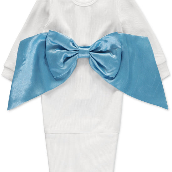 Carriage Boutique white ribbed newborn sleep sack featuring a large, shimmering blue satin bow on the front.