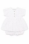 Carriage Boutique white baby girl dress with pink rosebud print, wooden buttons, and attached bubble bloomers.