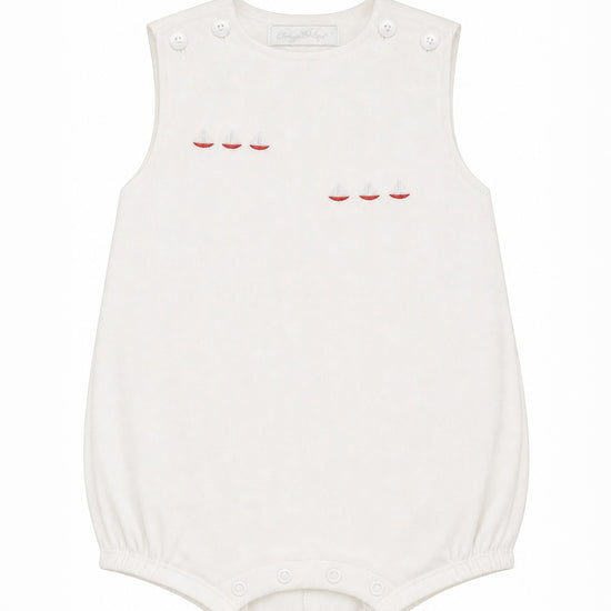 Carriage Boutique white sleeveless bubble with red sailboat embroidery and smocked detailing.