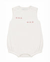 Carriage Boutique white sleeveless bubble with red sailboat embroidery and smocked detailing.