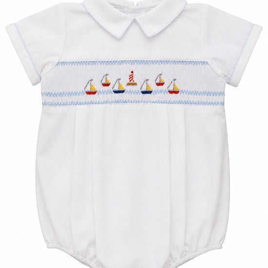 Carriage Boutique white bubble romper with smocked chest featuring sailboats and lighthouse, Peter Pan collar, blue piping.