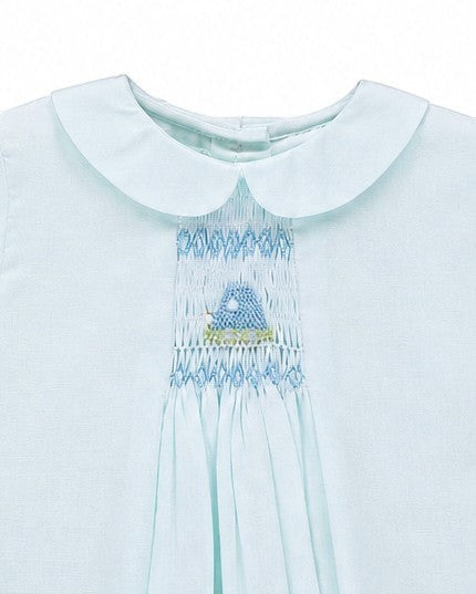 Carriage Boutique baby blue heirloom dress with Peter Pan collar, hand-smocked chest, and embroidered motif detail.