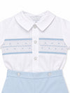 Carriage Boutique infant boy bobby suit with white collared shirt, hand smocking, and light blue cotton shorts.
