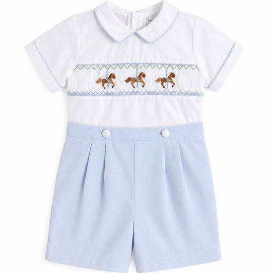 Carriage Boutique baby bobby suit in white and light blue with carousel horse smocking and a peter pan collar.