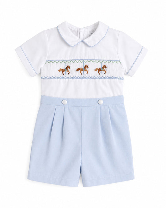 Carriage Boutique baby bobby suit in white and light blue with carousel horse smocking and a peter pan collar.