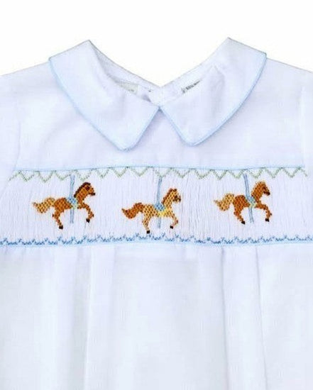 Carriage Boutique white bubble romper with smocked chest featuring carousel horse embroidery and blue piping.