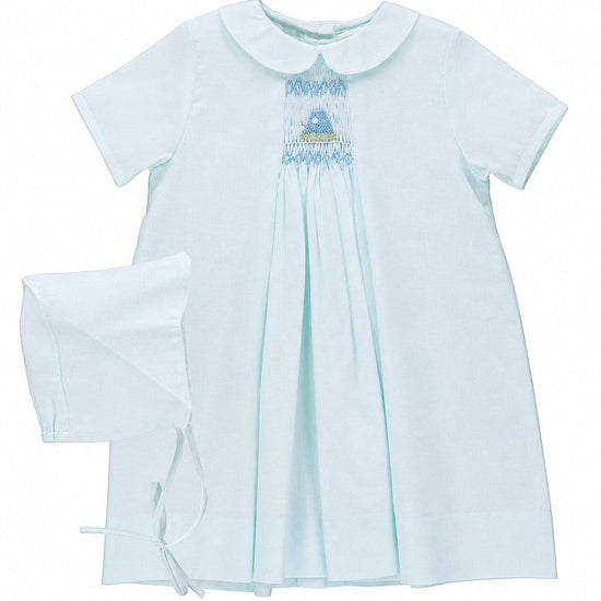 Carriage Boutique baby blue smocked heirloom dress with Peter Pan collar and matching bonnet for special occasions.
