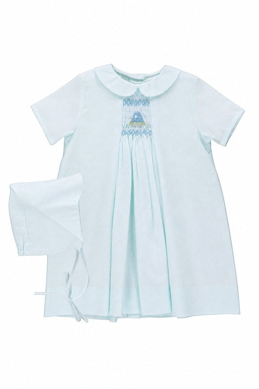 Carriage Boutique baby blue smocked heirloom dress with Peter Pan collar and matching bonnet for special occasions.