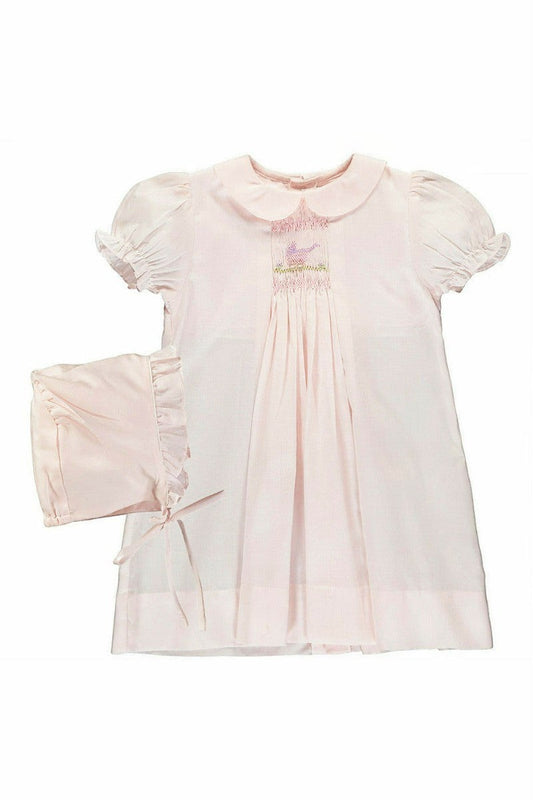 Carriage Boutique pale pink smocked heirloom dress with bird embroidery, Peter Pan collar, and matching ruffled bonnet.