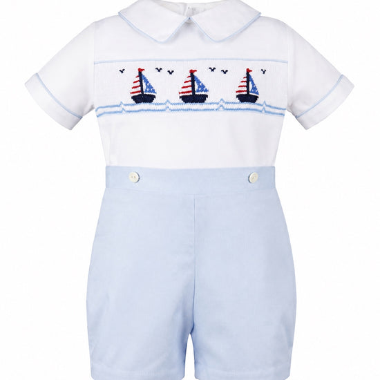 Carriage Boutique smocked bobby suit in white and light blue cotton with a sailboat pattern and peter pan collar.