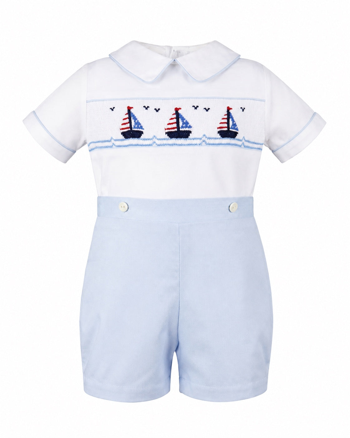 Carriage Boutique smocked bobby suit in white and light blue cotton with a sailboat pattern and peter pan collar.