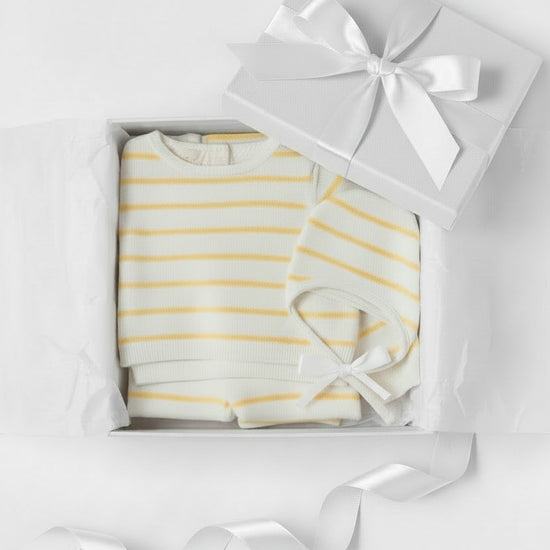 Carriage Boutique 3-piece baby gift set with white and yellow striped knit top, leggings, and matching bonnet in a box.