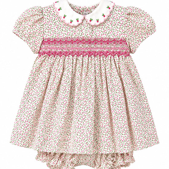 Carriage Boutique tan floral baby dress with puff sleeves, smocked red diamond detail, and white scalloped collar.