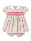 Carriage Boutique tan floral baby dress with puff sleeves, smocked red diamond detail, and white scalloped collar.