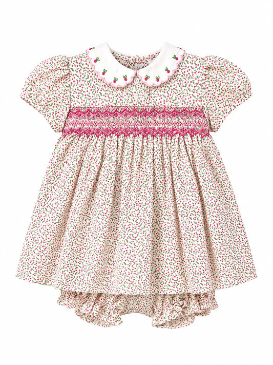 Carriage Boutique tan floral baby dress with puff sleeves, smocked red diamond detail, and white scalloped collar.