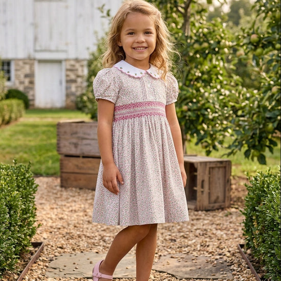 Carriage Boutique tan floral cotton toddler dress with puff sleeves, white collar, and smocked red diamond detail.