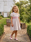Carriage Boutique tan floral cotton toddler dress with puff sleeves, white collar, and smocked red diamond detail.